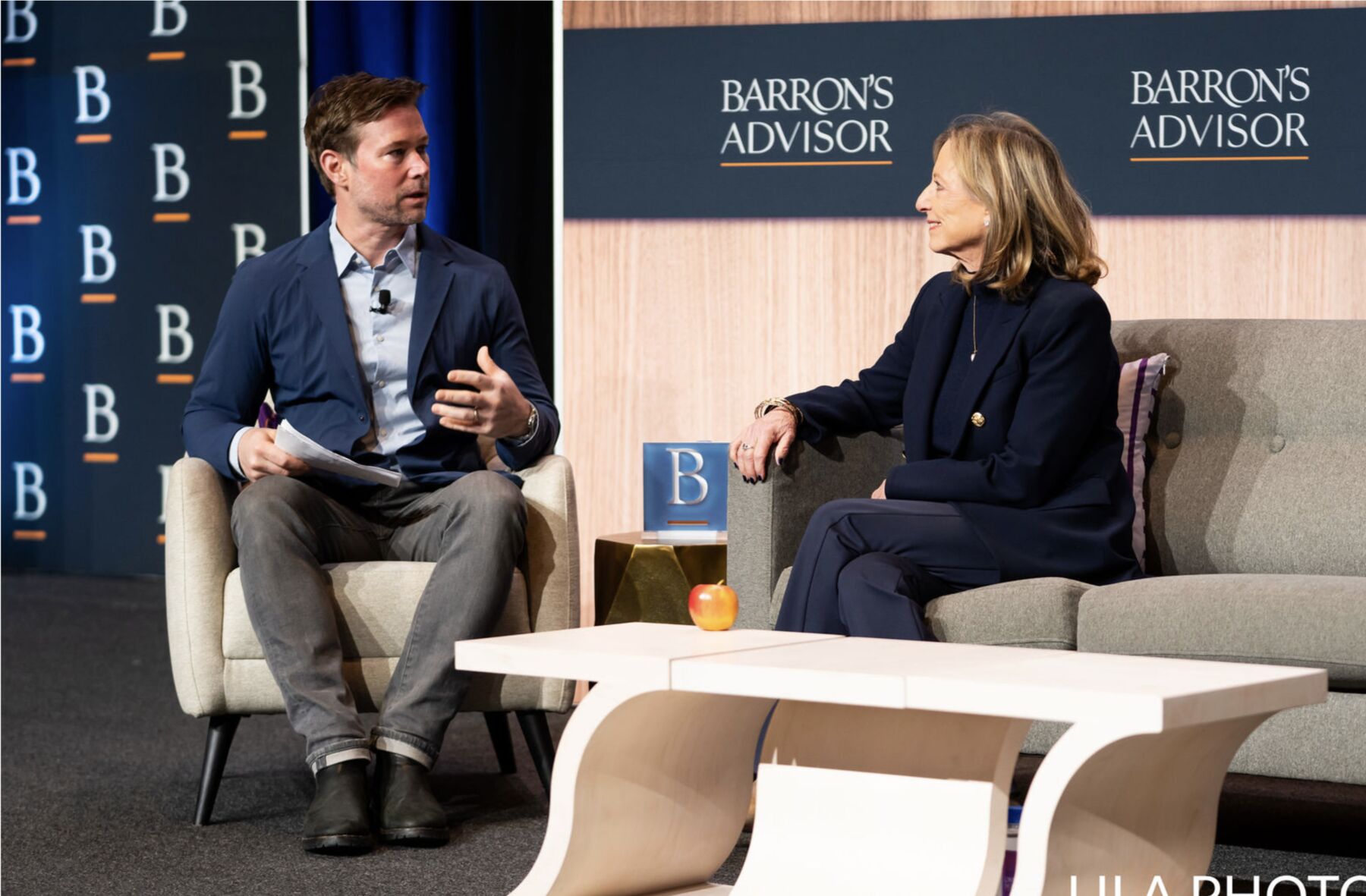 Matt Bean speaking on stage at Barron's Advisor
