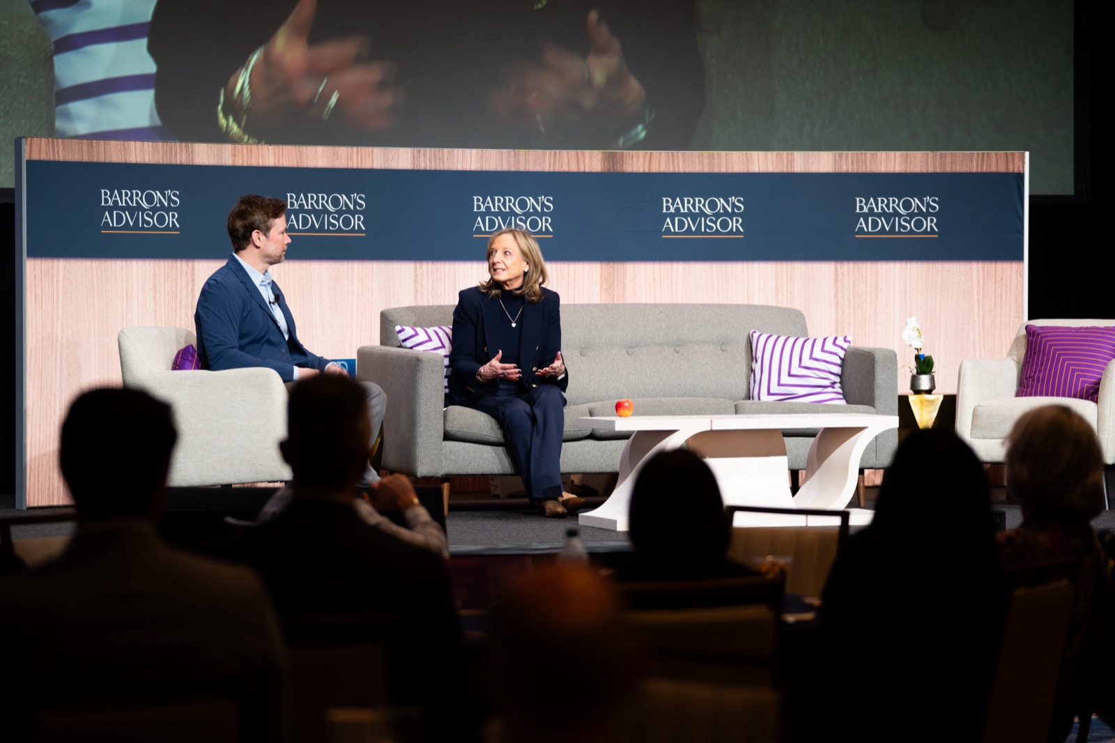 Matt Bean moderating a Barron's Advisor panel on stage