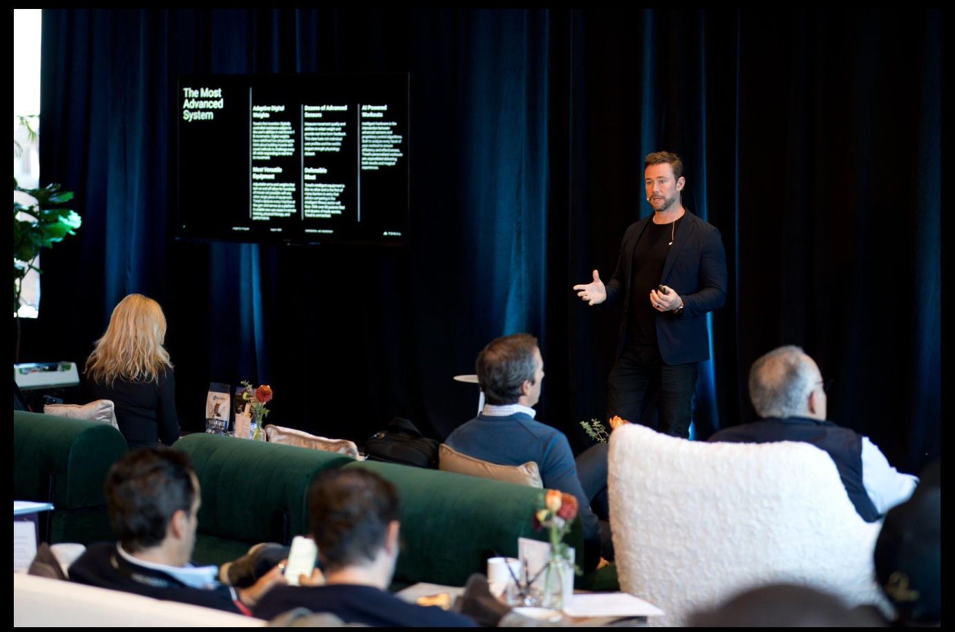 Matt Bean presenting on stage